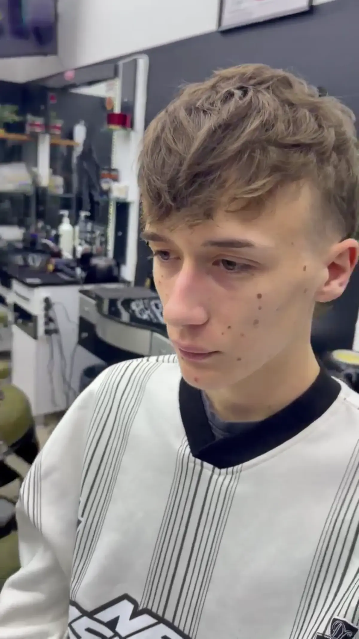 Play video: Video close-up of a seamless fade after a haircut at 7 Barber